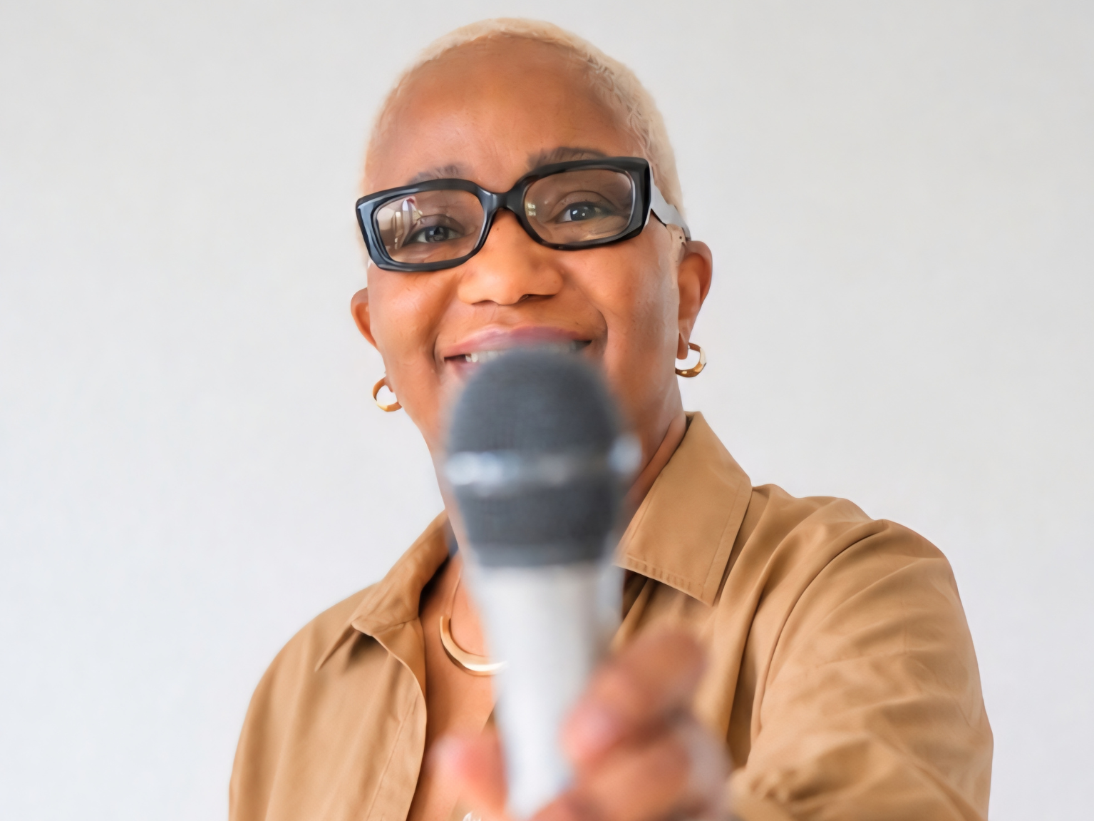Anita Lee speaking with a microphone