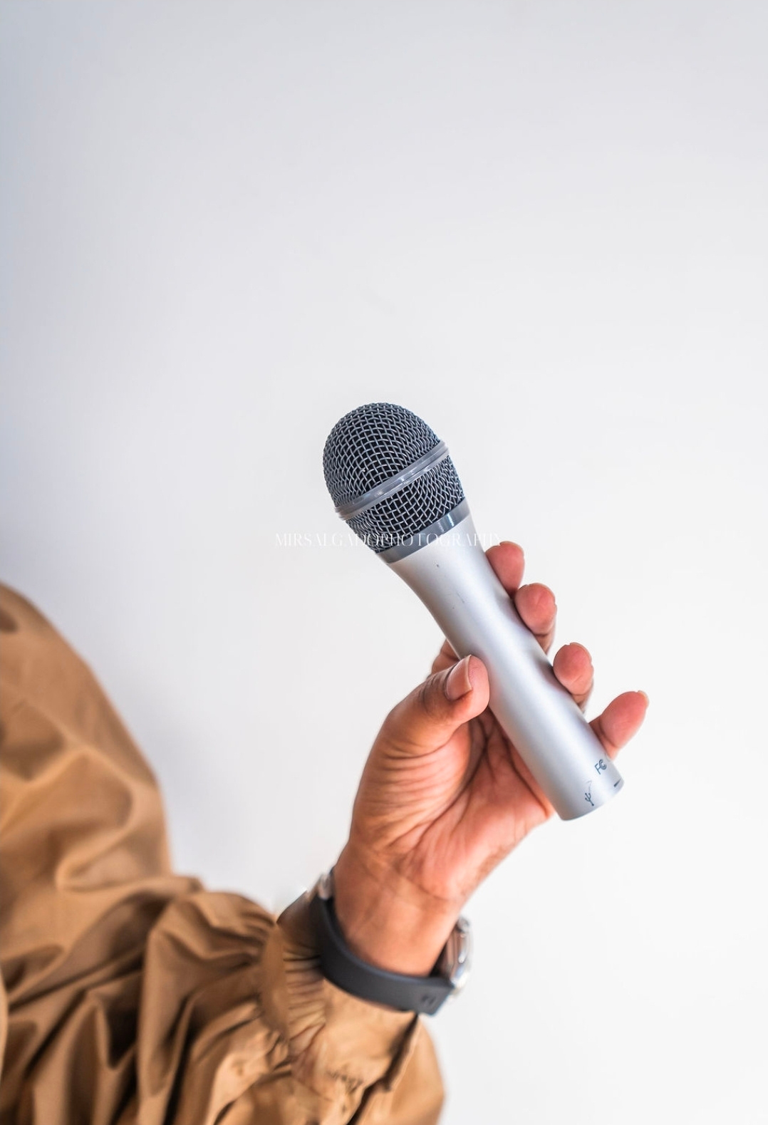 Anita Lee holding a microphone